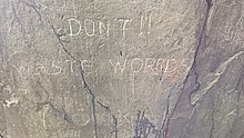 Inscription carved in rock wall at entrance to "bedroom": "DON'T !! WASTE WORRDS [OR] Jump to conclusions" It looks like the 2nd "R" in "WORRDS" was added later, that there is likely to be a missing "OR" (piece of rock probably fell off), and the 2nd part of the inscription was added later or by another hand.