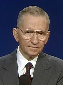 A still of the first televised 1992 debate depicting Ross Perot in front of a blue backdrop.