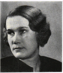 A black-and-white portrait photograph of Ruth Hamrin-Thorell, a pale-skinned woman with short, wavy hair. She looks away to the left, and is wearing a black top.