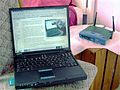 Image 20A laptop (with Wi-Fi module) and a typical home wireless router (on the right) connecting it to the Internet. The laptop shows its own photo (from Radio)