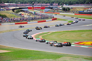 The pack running through the maggots-becketts complex at Silverstone during the 2010 British Grand Prix