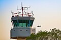 ATC Tower at Ramat David Airbase in August 2023 with an AS565 Panther Atalef flying by