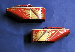 Side view of another pair. Red-gold-green brocade hanao, wood lacquered in red with gold and green decoration