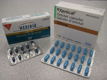 The cardboard packaging of two medications used to treat obesity.