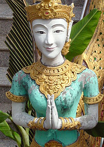Statue with namaste pose (wai) in a Thai temple