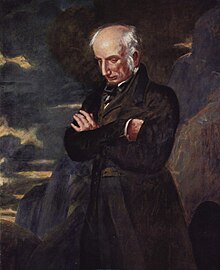 Three-quarter portrait of elderly man with a fringe of white hair around his head, looking down introspectively with his arms crossed. He is wearing a brown suit and is set against a brown, blue, and purple background that is reminiscent of rocks and clouds.