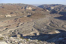 An alluvial plain near dry, rolling hills