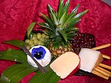An artful arrangement of cheese, fruit and bread