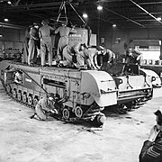Auxiliary Territorial Service (ATS) women working on a Churchill tank at a Royal Army Ordnance Corps depot, 10 October 1942. H24517 - Restoration