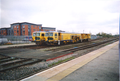 A pictures of a Amey Plc track/balast tamper in Banbury.