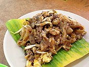 Penang-style char kway teow, here served on a piece of banana leaf
