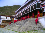 Monks at the entrance to the Prayer Hall of Drepung Monastery.