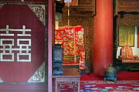 A room with traditional Chinese wedding decorations and rugs, Forbidden City in Beijing