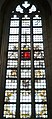 This is the only window remaining in the church showing the Damiate legend. It was originally given by Haarlem to Beverwijk in 1679.[6]