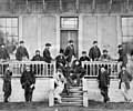 Members of the First Legislature after the Union of the Two Colonies, in front of The Birdcages, Victoria. 1870.