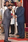 The President, Shri Ram Nath Kovind presenting the Padma Bhushan Award to Shri Mohanlal.