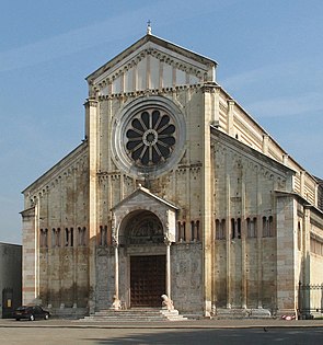 Church of San Zeno, Verona, Italy, The façade is neatly divided vertically and horizontally. The central wheel window and small porch with columns resting on crouching lions is typical of Italy.