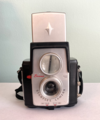 A Brownie Starflex camera with the cover for its finder window popped up.