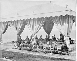 A gamelan ensemble with a group of singers (Sindhen (Female) and Gerong (Male) at the Mangkunegaran Royal Palace in Surakarta, Central Java, between 1870 and 1892