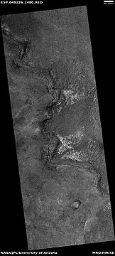 Light-toned material, as seen by HiRISE under HiWish program. Light-toned material is often associated with minerals that formed in water.