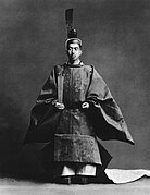 Emperor Showa wearing a sokutai and holding a shaku.