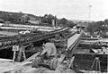 Barges being used to support Bailey bridging over the Seine at Mantes, France, August 1944