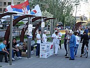 Members of the Serbian Progressive Party handing leaflets in Novi Sad in April 2012