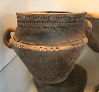 Cavetto zone, with three rows of indentations in the upper part, on a Neolithic German pot.