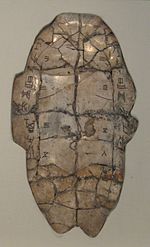 Tortoise plastron with divination inscription from the Shang dynasty, dating from the reign of King Wu Ding. The piece has complementary charges down the left and right sides. Cracks caused by applying a heat source to the reverse are numbered 1–6 on the left and 1–7 on the right. The outcome of the interpretation of these cracks is recorded at bottom right.