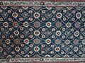 A carpet with Minakhani motif