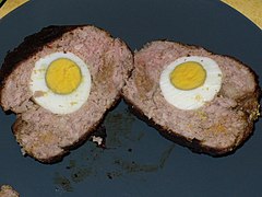 Slices of meat with hard-boiled eggs in the middle.