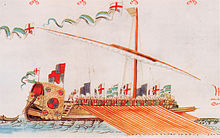 A colourful image of a one-masted vessel propelled by a large group of rowers. Toward the back of the ship a man is holding a raised baton, urging the rowers on.
