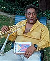 Dizzy_Gillespie_holding_memoir_"To_Be_or_Not_to_Bop"