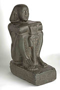 Basalt sculpture of Harsomtus em hat from the twenty-sixth Dynasty of Egypt.