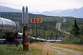 Oil pipeline winding through cold Alaskan country-side. In the background are mountains, partly snow-capped (from Transport)