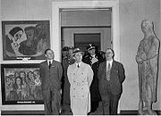 Photo of the Degenerate Art Exhibition in Haus der Kunst visited by Goebbels with two of Nolde's paintings (hanging left of the door), in Feb. 1938.
