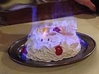 A bombe Alaska which has been flambéed with alcohol at a restaurant in Singapore