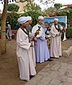 Egyptian musicians wearing galabiyat