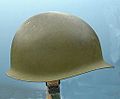 An M1 helmet, the standard helmet of the U.S. Army from 1941 through the Vietnam War. This helmet is from the Vietnam War; the color is olive green 107.