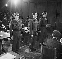 Meyer in court, standing between two guards