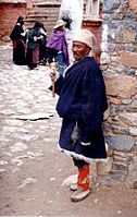 Pilgrim with prayer wheel, Tsurphu Monastery, 1993