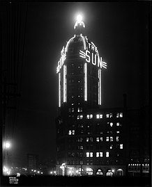 Neon 'Sun' sign and beacon at night (1946)