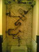 "Steampunk" styled urinal at a bar