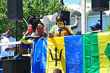 The flag of Barbados displayed at a festival.