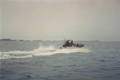 A motorboat of the Bermuda Regiment Boat Troop moves out of the Great Sound, past the HMD, Bermuda, on Ireland Island.