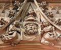 Depiction of St. Veronica's sudarium over the portal of the Minster of the Holy Cross