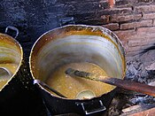 Big pots of locro cooked on coal