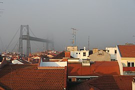 The bridge emerges from the fog, view from Portugalete.