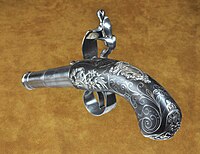 A Queen Anne pistol by Turvey of London with exceptional silver decoration