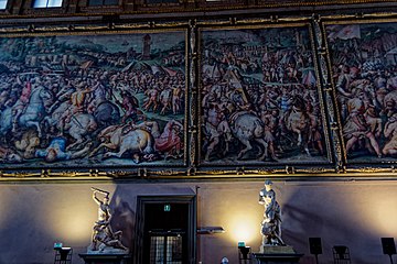 View on the West Wall with huge Battle Frescoes 1494 by Vasari & Assistants II. Site of the never done Battle of Cascina.